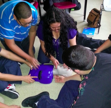 Students preparing to administer mouth-to-mouth breathing
