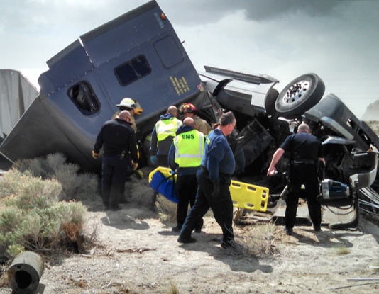 Wendover Police Firemen and EMT’s rush to the aid of a truck driver.