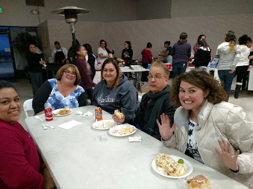 Parents and other community members enjoying themselves while raising money for much needed chairs for future events like Plays, Prom, Graduation and other School activities. Photo Credit Lysette Perez