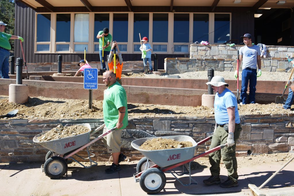 National Public Land Day volunteers prepare soil around the Lehman Caves Visitor Center’s new accessibility ramp for landscaping. (Photo credit Ely BLM staff)