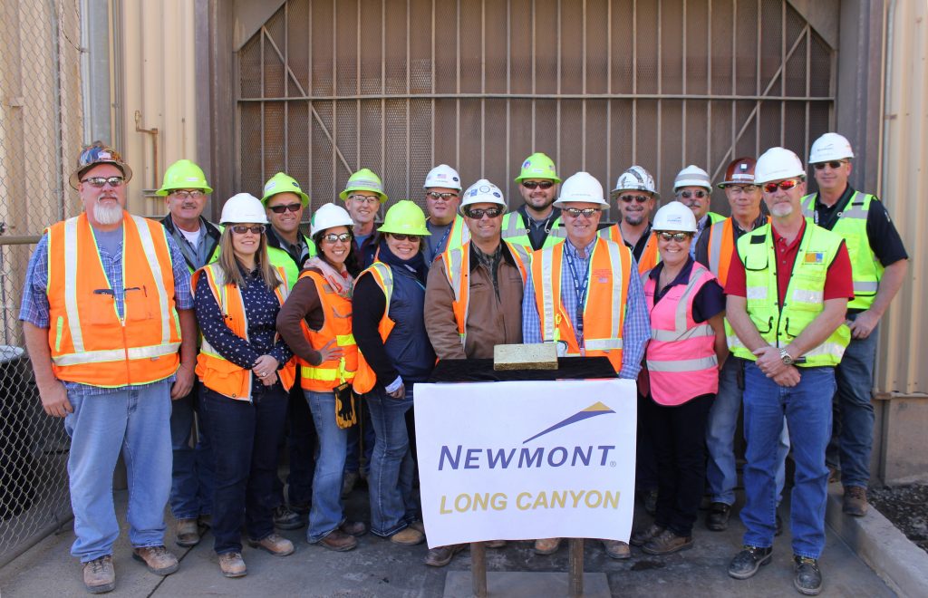 The Long Canyon Site Leadership team posing with one of the first doré bars to be poured from gold mined at their site. (Photo credit Newmont).