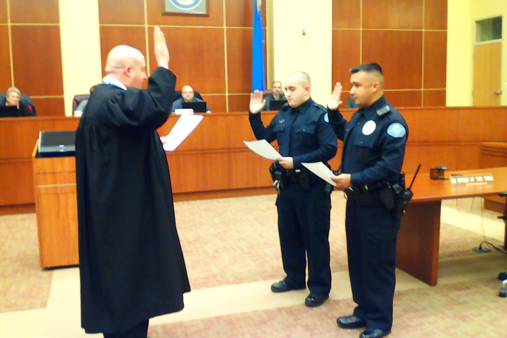 The two police officers sworn into the West Wendover Police, Fernando Uribe, and Miguel Pantelakis, here by Judge Brian Boatman (Photo High Desert Advocate).